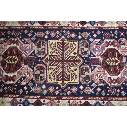 564 - A Patterned Woollen Rug, 170x100cm