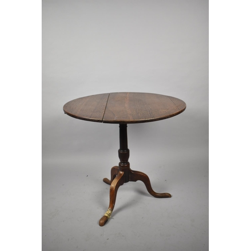 578 - A 19th Century Snap Top Oak Tripod Table, One Foot Repaired, 75cm Diameter