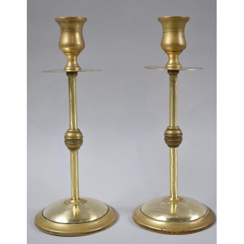 76 - A Pair of Ecclesiastic Style Brass Candlesticks, 21.5cm high