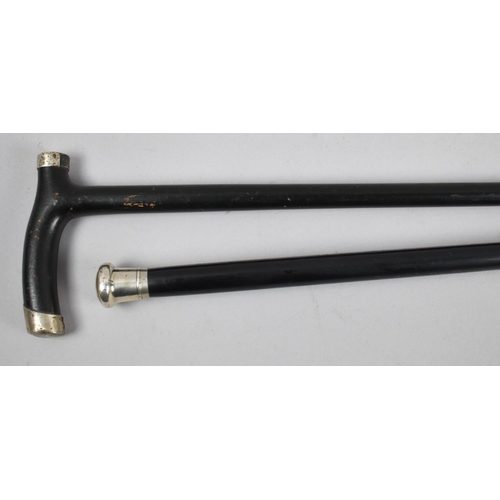 104 - Two Ebonised Walking Canes, One with Silver Mounts, Hallmarked for Birmingham 1922