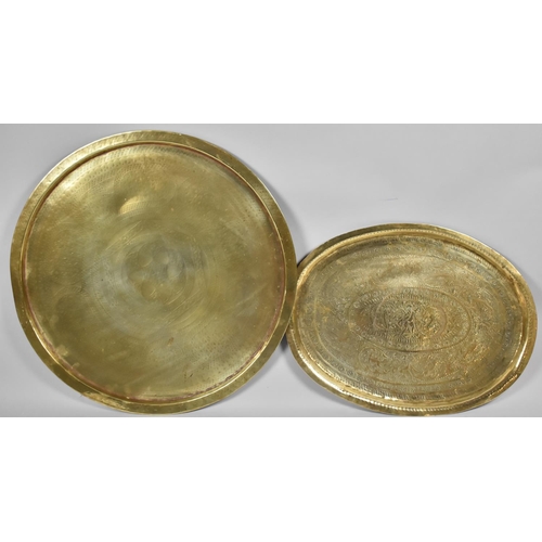 121 - A Circular Brass Benaries Tray Top, 63cm Diameter and an Indian Brass Oval Tray Decorated with Danci... 