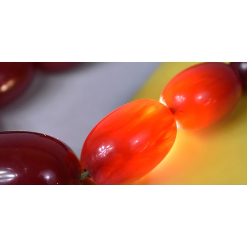 241 - A Cherry Amber Necklace Together with another Example