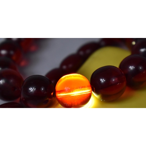 241 - A Cherry Amber Necklace Together with another Example