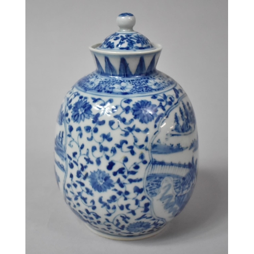 256 - A Chinese Blue and White Lidded Vase with Cartouche Exterior Scene Decoration Depicting Village Scen... 