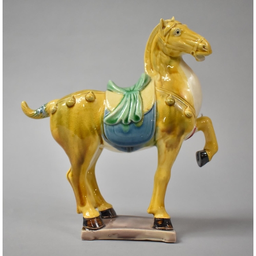 269 - A Chinese Sancai Glazed Tang Style Horse, 20.5cm high