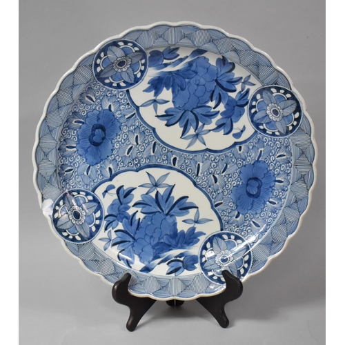 272 - A 19th Century Japanese Blue and White Porcelain Charger Having Wavy Rim, Chip to Rim, 44cm Diameter