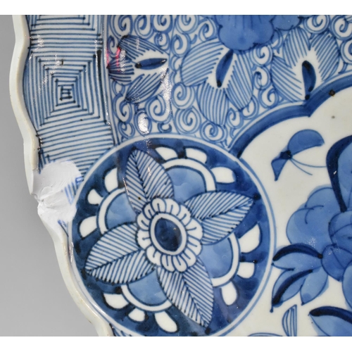 272 - A 19th Century Japanese Blue and White Porcelain Charger Having Wavy Rim, Chip to Rim, 44cm Diameter