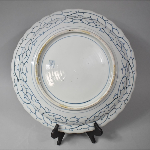 272 - A 19th Century Japanese Blue and White Porcelain Charger Having Wavy Rim, Chip to Rim, 44cm Diameter