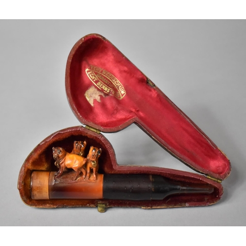 73 - A Cased Carved Meerschaum Pipe Decorated with Three Pug Dogs and Amber Mouthpiece