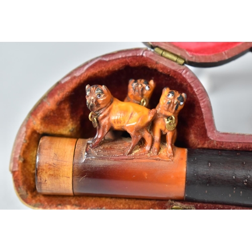 73 - A Cased Carved Meerschaum Pipe Decorated with Three Pug Dogs and Amber Mouthpiece