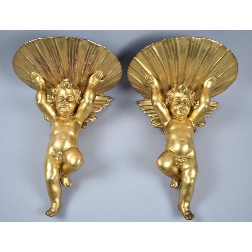 84 - A Pair of Gilt Composition Sconces in the Form of Cherubs, 27cm high