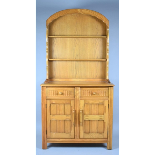 91 - A Mid 20th Century Dresser with Domed Top and Two Shelf Plate Rack, Two Centre Drawers and Base Cupb... 