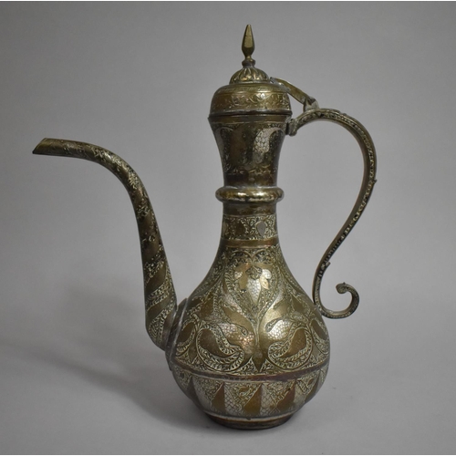 111 - An Islamic Coffee Pot with Engraved Floral and Geometric Decoration