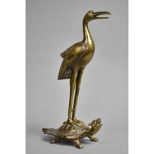 112 - A Japanese Bronze Study of a Crane Standing on Tortoise, 22cms High