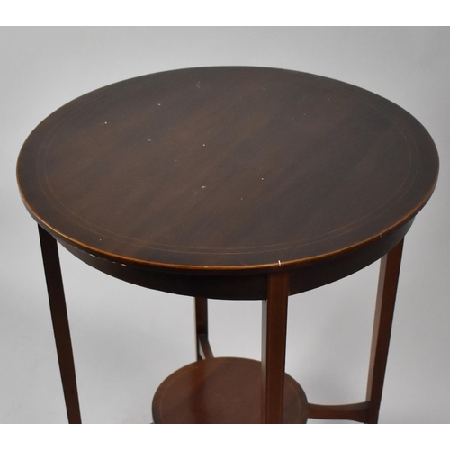 119 - A Mahogany String Inlaid Circular Occasional Table with Stretcher Shelf, 71cms High