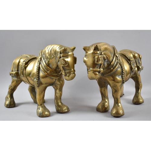 124 - A Pair of Large and Heavy Cast Brass Heavy Horses, Both Measuring 32x24.5cms High