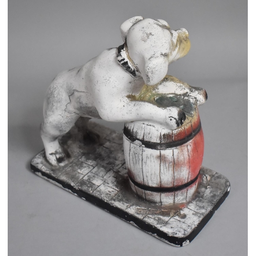 134 - A Vintage Chalkware Study of Dog Leaning on Barrel, 23cms High, Condition Issues to Include Loss to ... 