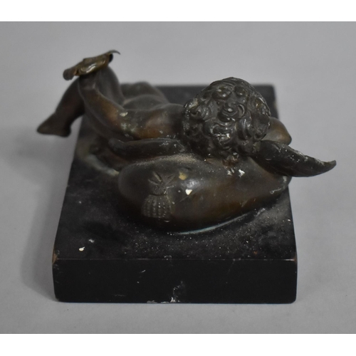 3 - A Bronze Metal Study of a Reclining Cherub on Cushion with Flower in Hand Mounted on Rectangular Bas... 