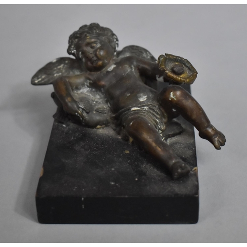 3 - A Bronze Metal Study of a Reclining Cherub on Cushion with Flower in Hand Mounted on Rectangular Bas... 