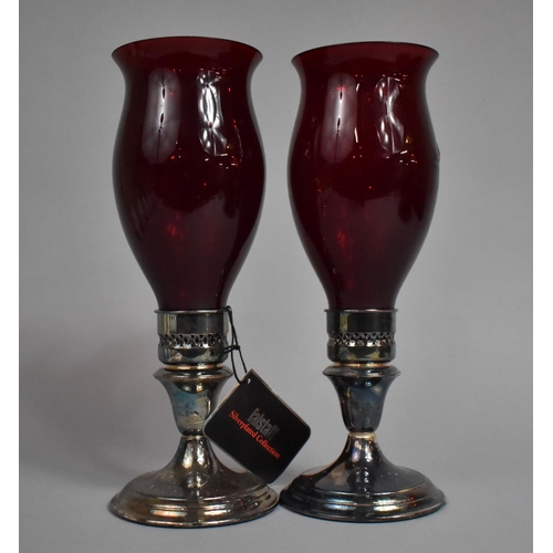 33 - A Pair of Falstaff Silver Plated Hurricane Lamps with Ruby Glass Shades, 27.5cms High