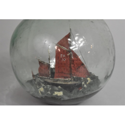 51 - A Late 19th/Early 20th Century Glass Float Containing Sailing Boat Diorama, 40cms Diameter