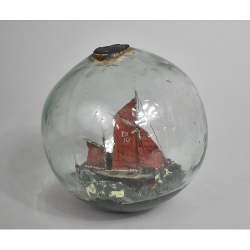 51 - A Late 19th/Early 20th Century Glass Float Containing Sailing Boat Diorama, 40cms Diameter