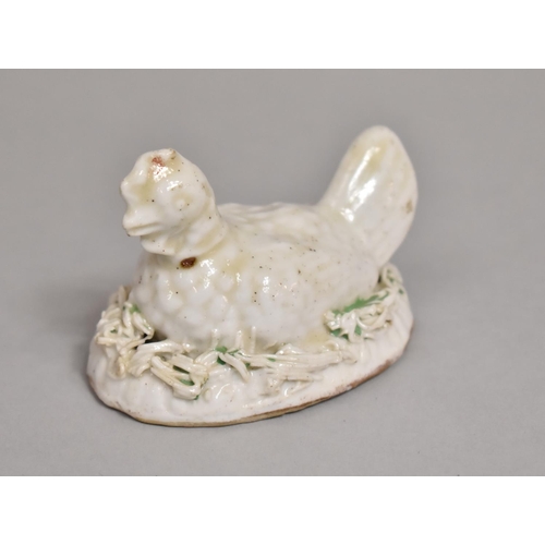 574 - A 19th Century Small Staffordshire White Glazed Hen Set on Naturalist Base