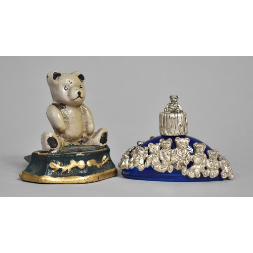 575 - A Cast Metal Painted Doorstop with Teddybear Decoration together with a Metal and Blue Glass Perfume... 