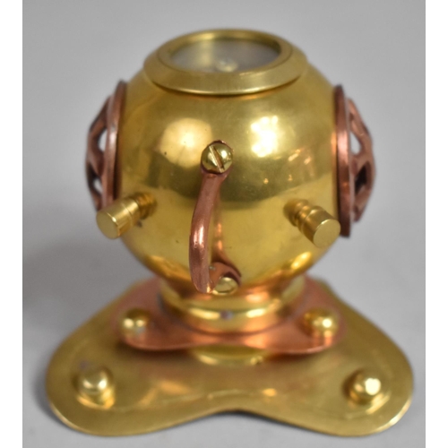 65 - A Novelty Brass and Copper Desk Top Compass in the Form of a Divers Helmet, 8.5cms High