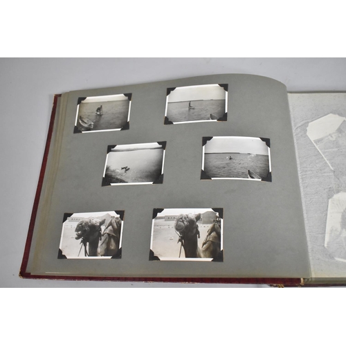 80 - A Vintage Album Containing 80 Monochromatic Photographs including Military Campaigns, Travel, Ships,... 