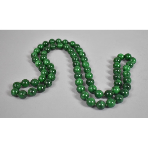 444 - A Jadeite Pendant with Gilt Clasp, 6cm high