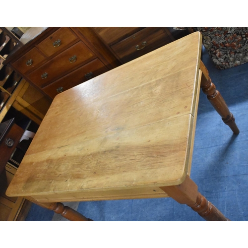 515 - A Stripped Pine Kitchen Table on Turned Support with Single Drawer, 114cm x 78cm