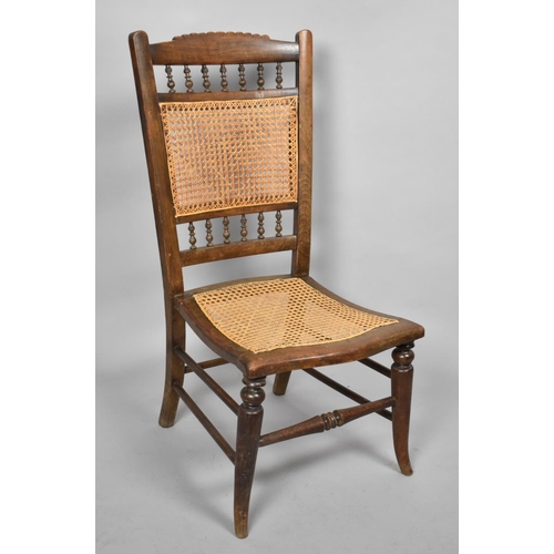 523 - An Early 20th Century Cane Seated and Back Ladies Nursing Chair