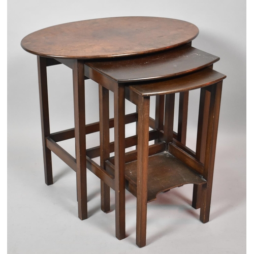 534 - A Mid 20th Century Nest of Three Oval and Rectangular Topped Tables, 58cm Wide