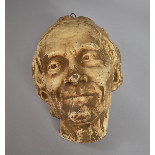 57 - A 19th Century Plaster Wall Hanging Bust of Voltaire, 30x20x18cms