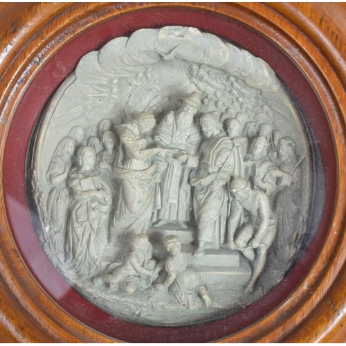 156 - A 19th Century Plaster Cast Roundel depicting an Old Testament Scene in a Glazed Turned Frame. 35cms... 