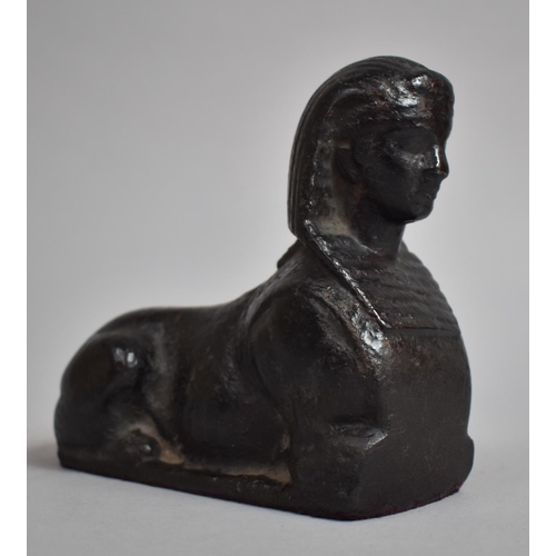 118 - An Early 19th Century Regency Cast Iron Sphinx Desk Weight. 12cms