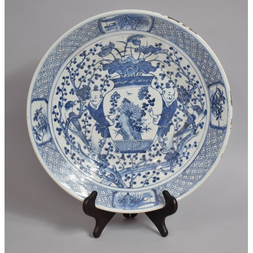 350 - A 19th Century or Earlier Chinese Blue and White Charger, Decorated with Attendants Carrying Antique... 