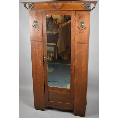 436 - An Arts and Crafts Oak Single Wardrobe with Mirror Front and Having Pressed Copper Rosettes and Hear... 