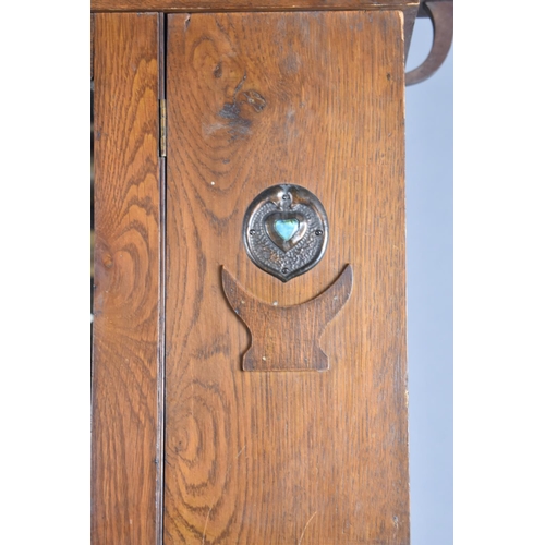 436 - An Arts and Crafts Oak Single Wardrobe with Mirror Front and Having Pressed Copper Rosettes and Hear... 