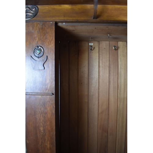 436 - An Arts and Crafts Oak Single Wardrobe with Mirror Front and Having Pressed Copper Rosettes and Hear... 