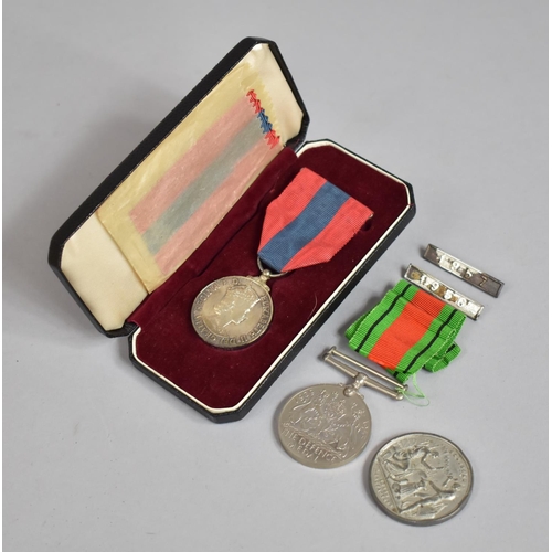 74 - A Cased Elizabeth II Imperial Service Medal Awarded to Arthur Cecil Lloyd, a WWII Defence Medal and ... 