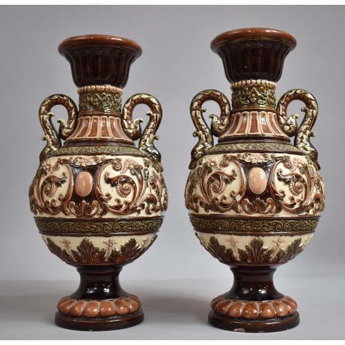 291 - A Pair of  German Majolica Twin Handled Vases Decorated in Relief with Scrolls and Foliage. 35.5cms ... 