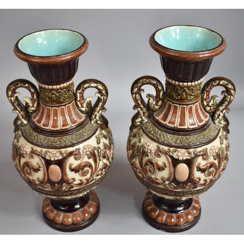 291 - A Pair of  German Majolica Twin Handled Vases Decorated in Relief with Scrolls and Foliage. 35.5cms ... 