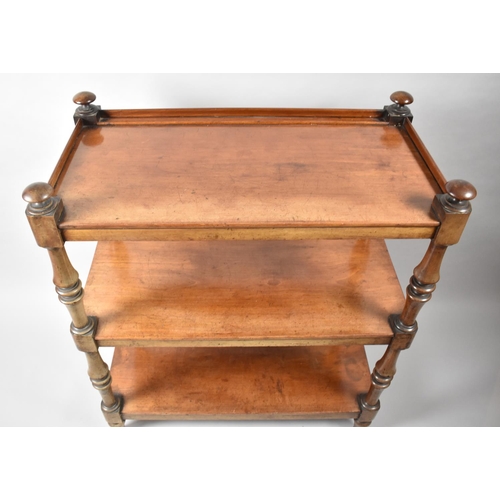 7 - A Victorian Mahogany Three Tier Buffet with Galleried Top Shelf and Turned Supports. 86x46x102cms Hi... 