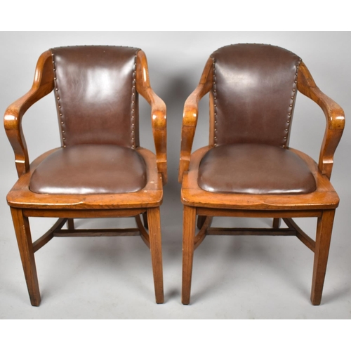 427 - A Near Pair of Edwardian Oak Office Chairs with Hide Seats and Backs