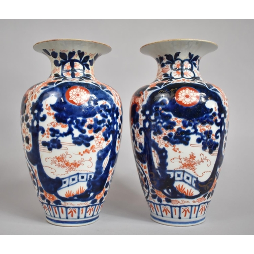 382 - A Pair of Early 20th Century Japanese Imari Vases with Clobbered Decoration. 25cms High