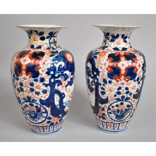 382 - A Pair of Early 20th Century Japanese Imari Vases with Clobbered Decoration. 25cms High