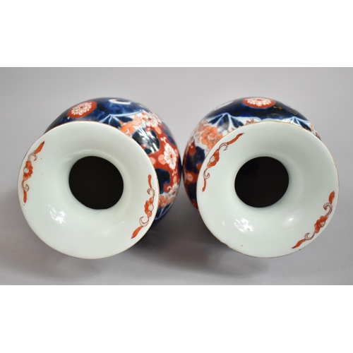 382 - A Pair of Early 20th Century Japanese Imari Vases with Clobbered Decoration. 25cms High