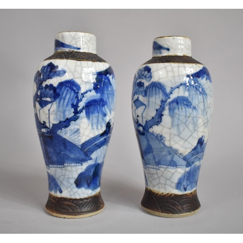 361 - A Pair of Chinese Blue and White Nanking Crackle Glazed Vases decorated with Figures, Oxidised Rims ... 